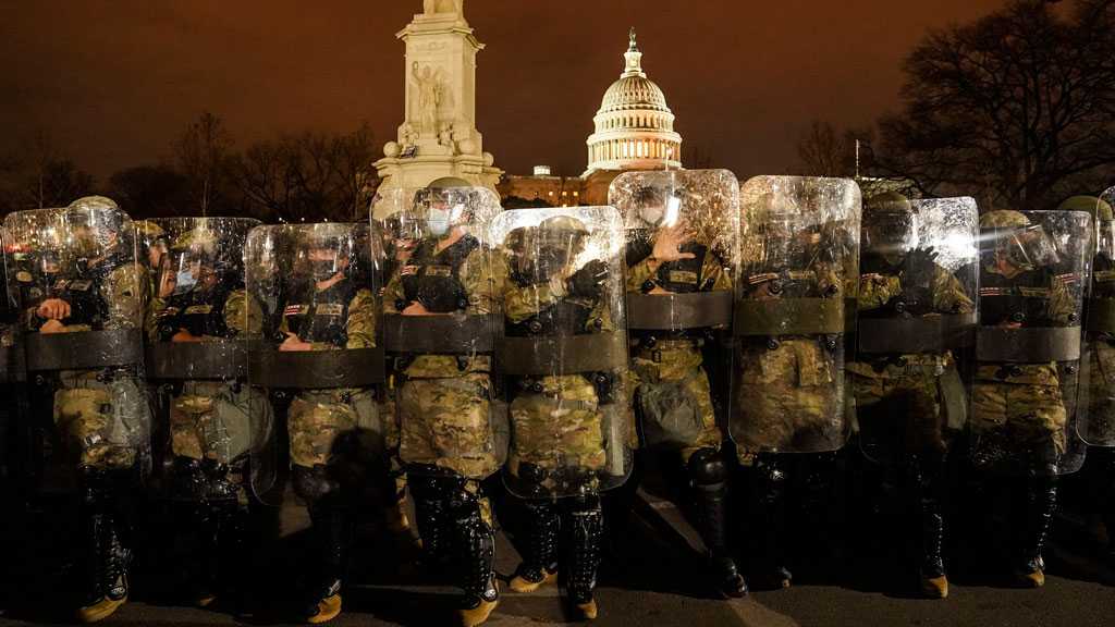 US Senate Reconvenes for Electoral College Vote Count with Heavily Armed Guards After Capitol Siege