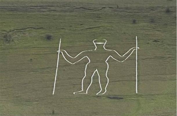 The Long Man of Wilmington temporarily defaced with the addition of a painted facemask. (@Jeremy_Christey)