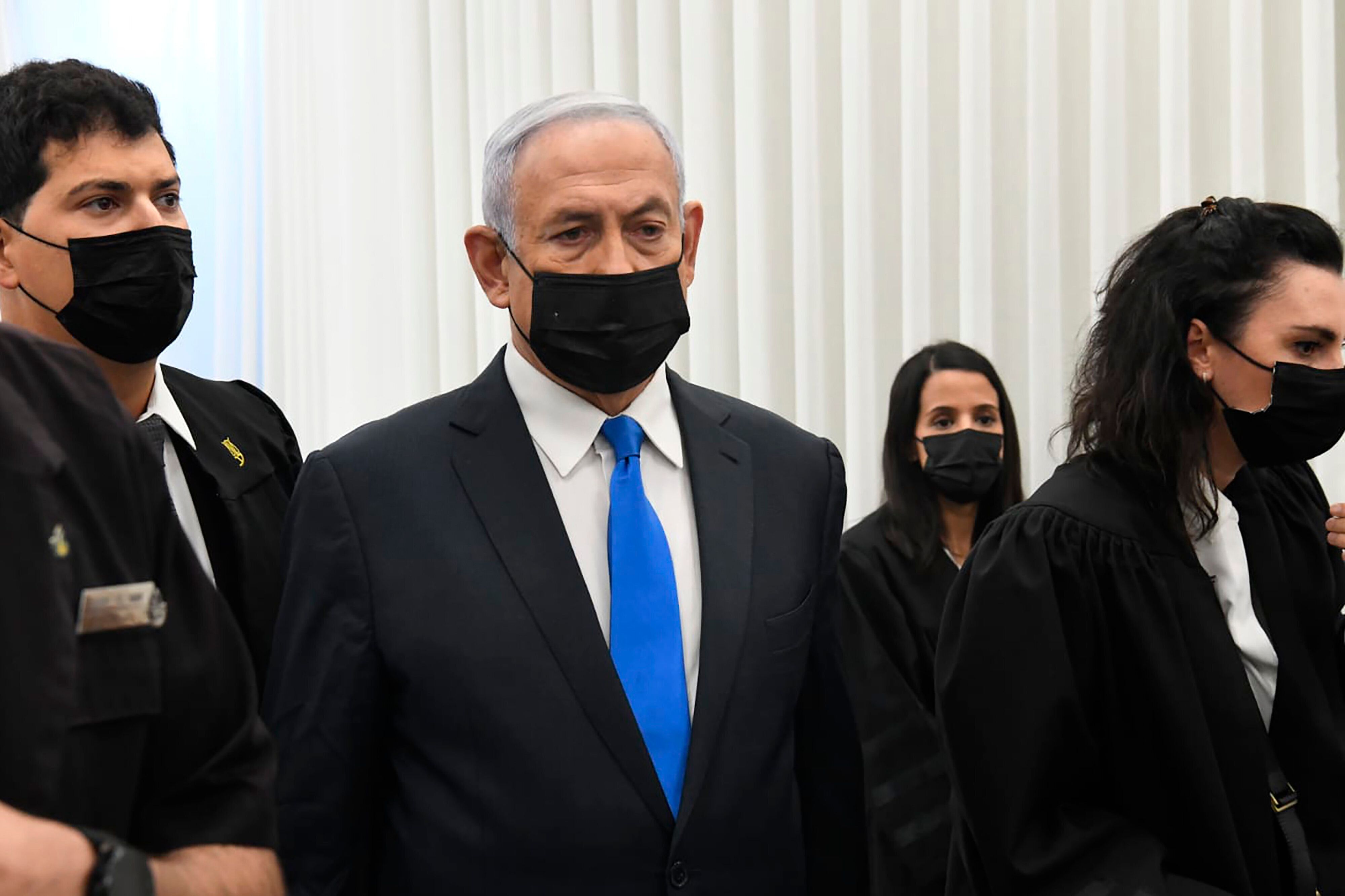 Israeli Prime Minister Benjamin Netanyahu stands at a hearing at the district court in Jerusalem, on Feb. 8, 2021.&nbsp;