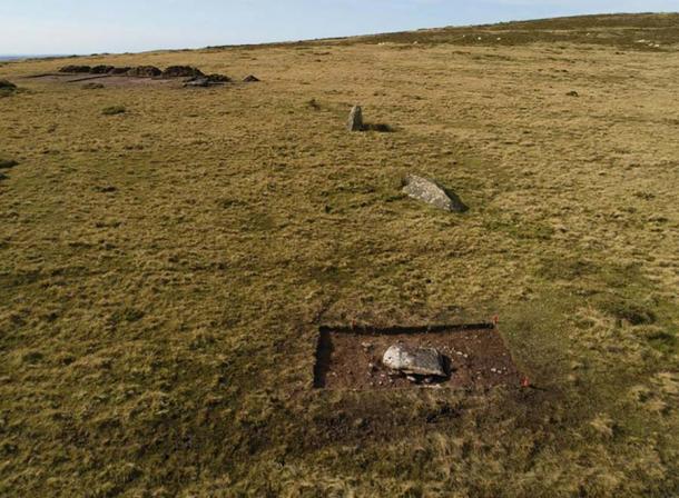 The arc of former standing stones at Waun Mawn during trial excavations in 2017, viewed from the east. Only one of them (third from the camera) is still standing. Recumbent stone 13 is in the foreground (photograph by A. Stanford/ Antiquity Publications Ltd)