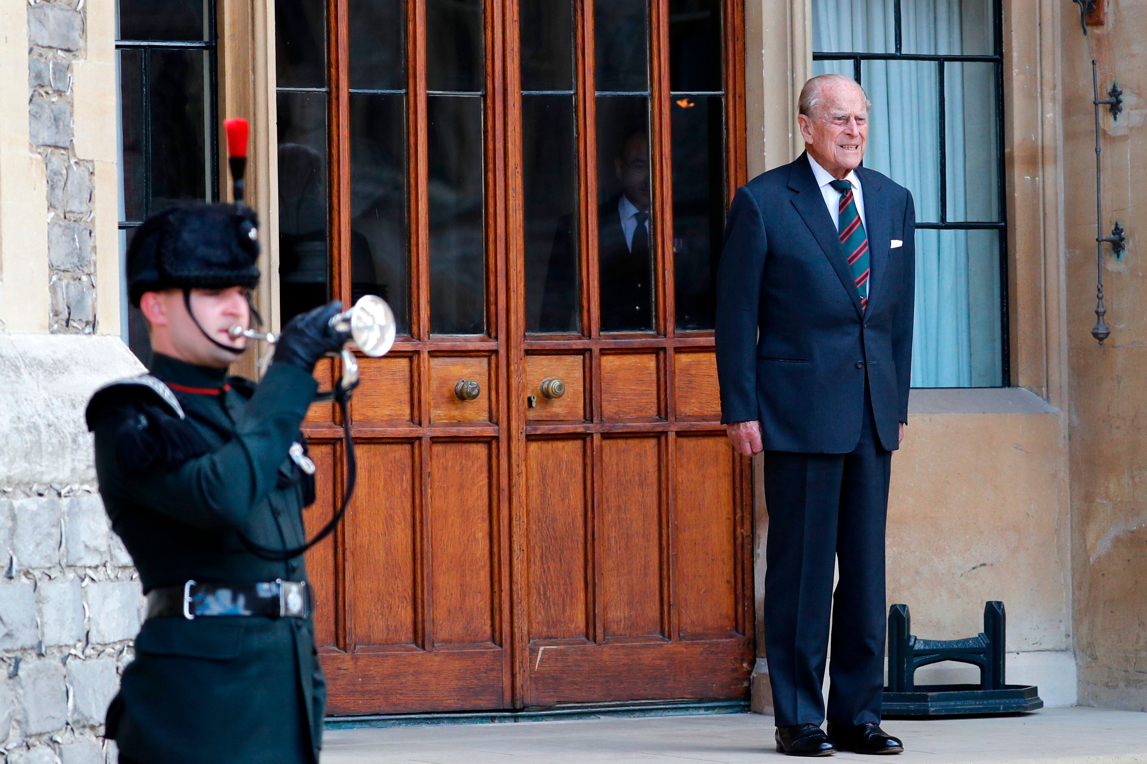 The Duke of Edinburgh listens to buglers during the transfer of the Colonel-in-Chief of The Rifles at Windsor castle in Winds