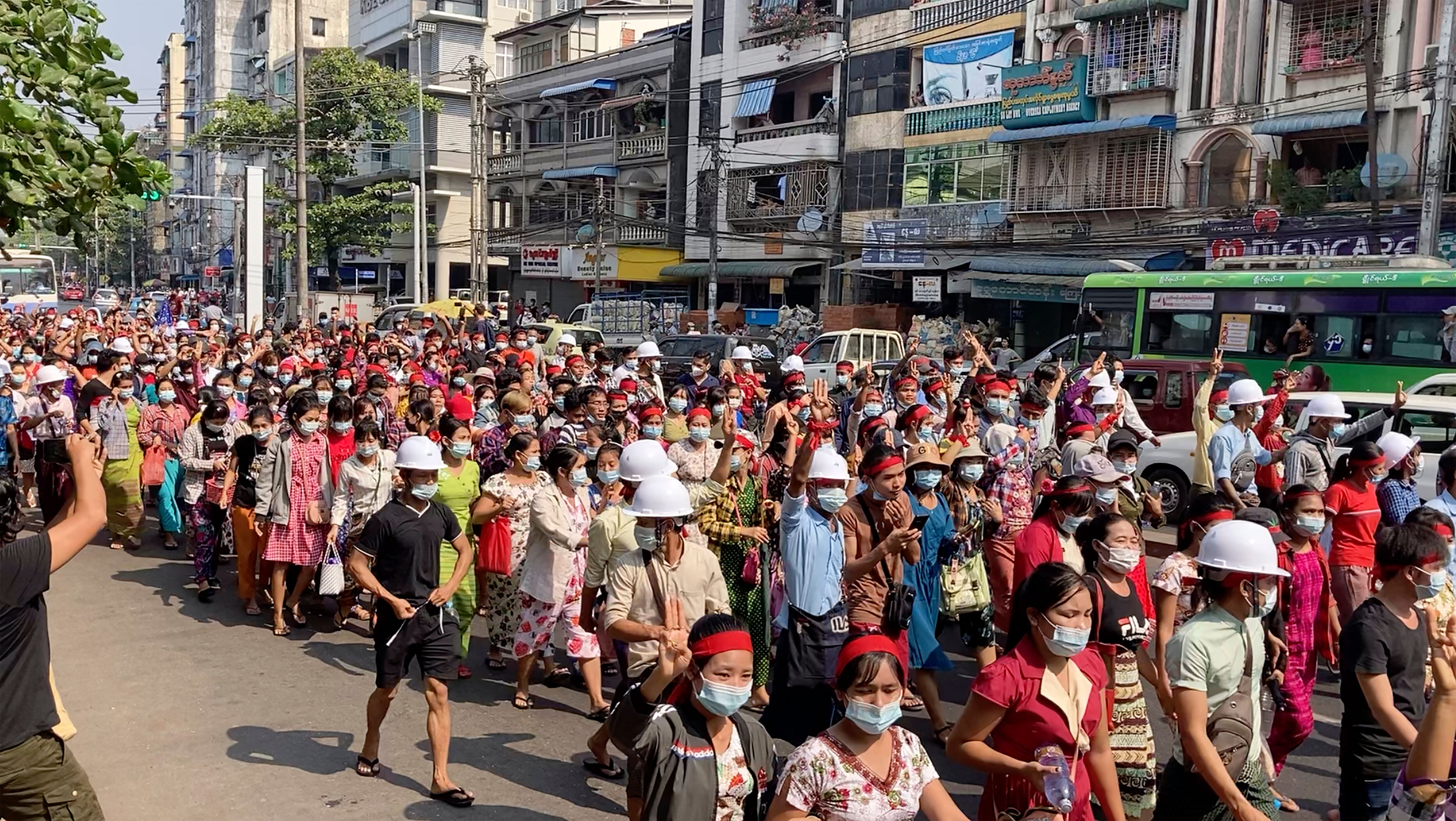 In this image from video, a crowd of protesters march in Yangon, Myanmar Saturday, Feb. 6, 2021.&nbsp;