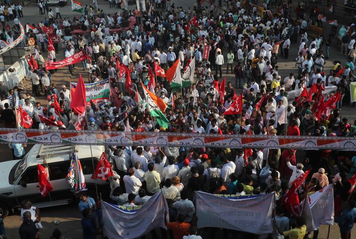 Members of different political parties participate in a protest against new farm laws in Mumbai, India, Saturday, Feb. 6, 202