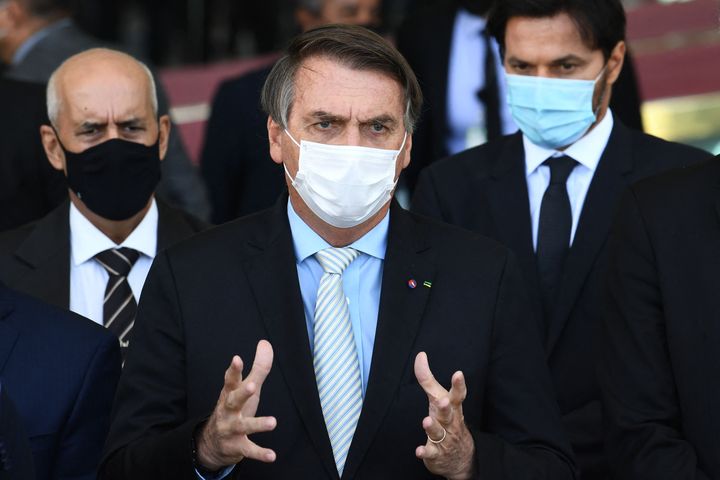 Brazilian President Jair Bolsonaro speaks to the press after meeting with the heads of the three government branches and thei