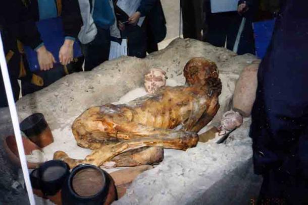 The Gebelein predynastic mummies were preserved through a natural mummification process thanks to the conditions in the desert. They provide a window into understanding the development of the mummification through time. The image shows the reconstructed sand grave of one of the males at the British Museum. (InSapphoWeTrust / CC BY-SA 2.0)