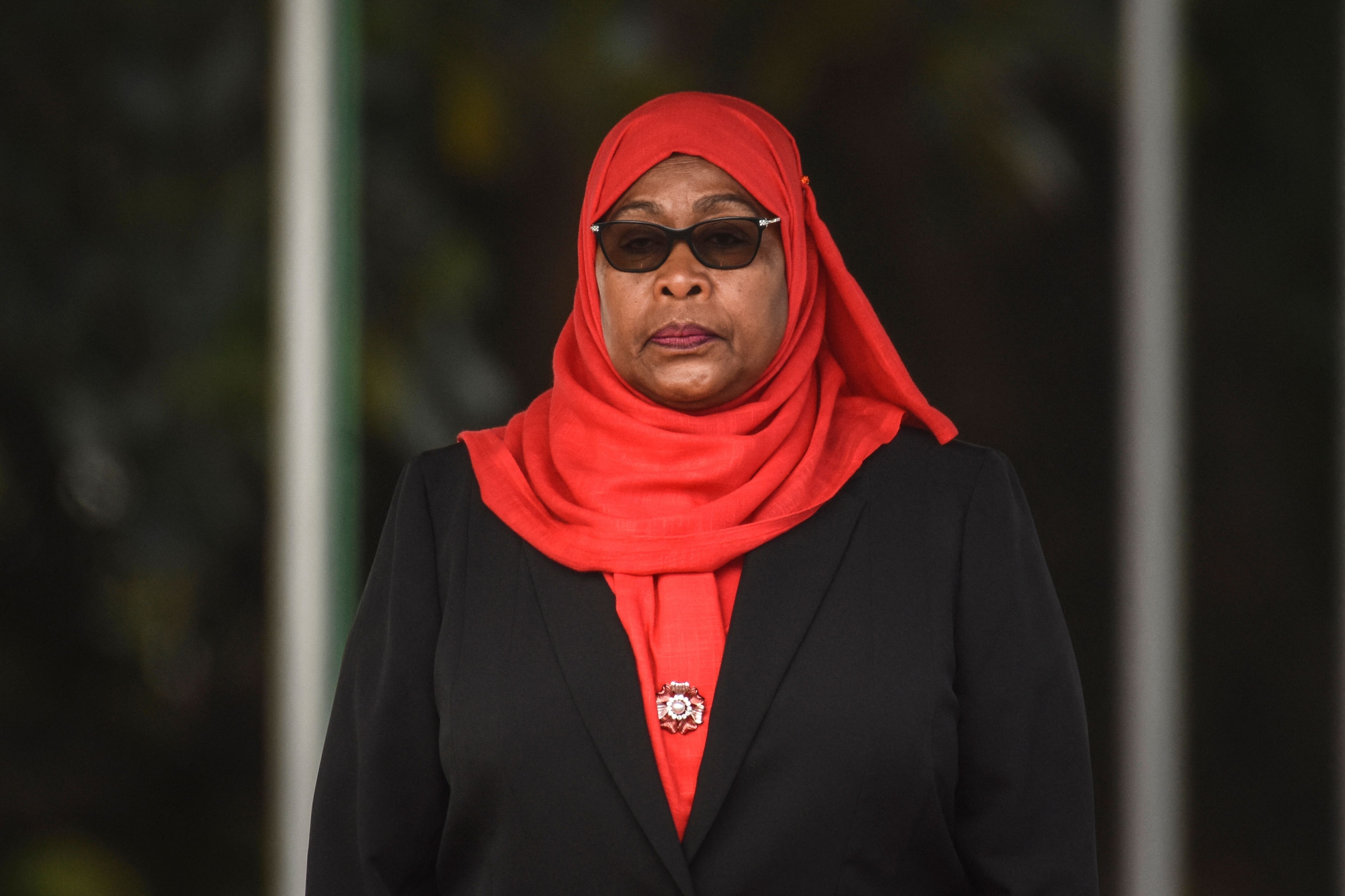 Tanzanian President Samia Suluhu Hassan inspects a military parade following her swearing in the country's first female presi