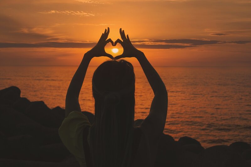 Image of a woman at sunset