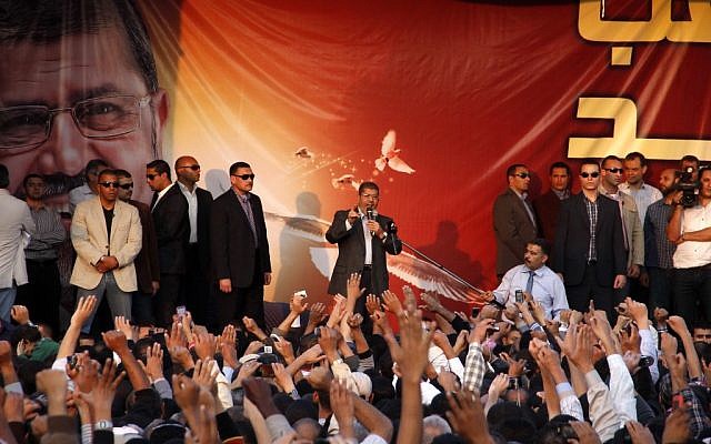 Egyptian President Mohammed Morsi speaks to supporters outside the Presidential palace in Cairo, Egypt, Friday, Nov. 23 (photo credit: AP/Aly Hazaza, El Shorouk)