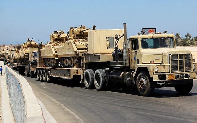Army trucks carry Egyptian military tanks in Egypt's northern Sinai Peninsula, Thursday, Aug. 9, 2012. (photo credit:AP)