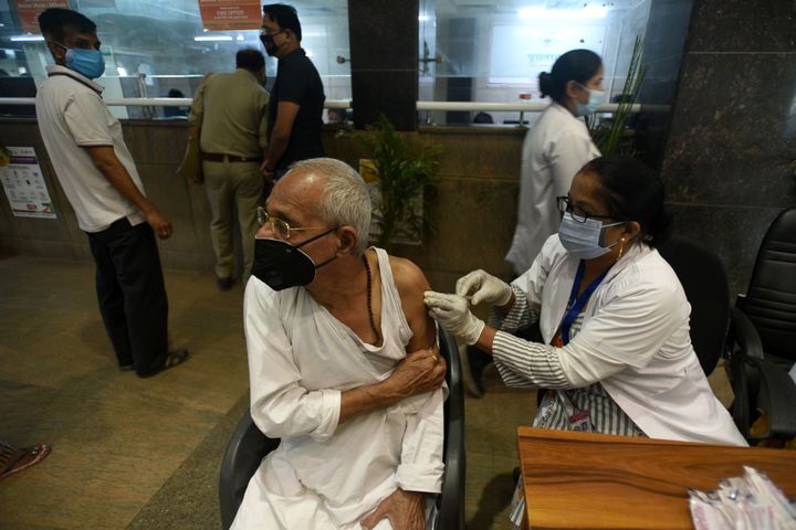 NOIDA, INDIA - APRIL 24: An elderly man gets vaccinated against Covid-19, at a district hospital at sector 30, on April 24, 2