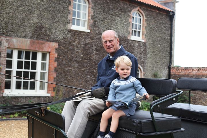 The Duke of Edinburgh and his great-grandson, Prince George, at Norfolk in 2015.