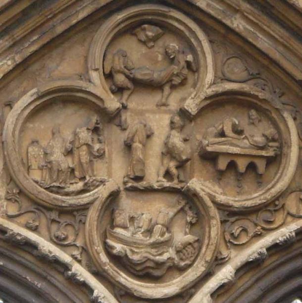 The quatrefoil above the west door of the Crowland Abbey shows four relief scenes from the life of St Guthlac. (Thorvaldsson / CC BY 3.0)