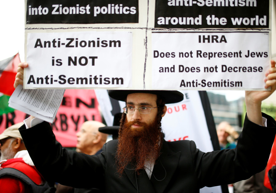 PROTESTING OUTSIDE a meeting of the British Labour Party’s National Executive, which was set to discuss the party’s definition of antisemitism, in London in September 2018. (Photos: Henry Nicholls/Reuters)