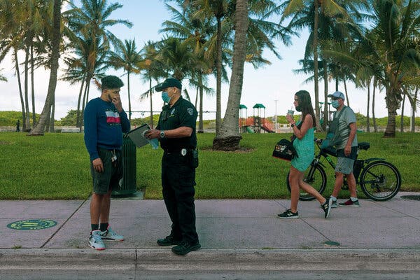A Miami Beach officer confronting a man without a mask last year.