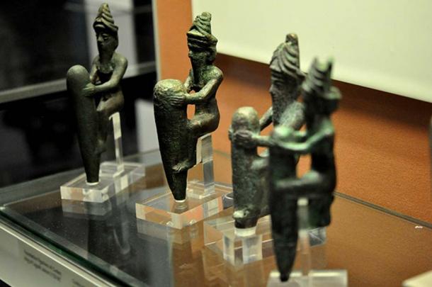 Four copper-alloy statuettes dating to c. 2130 BC, depicting four ancient Mesopotamian gods, wearing characteristic horned crowns.