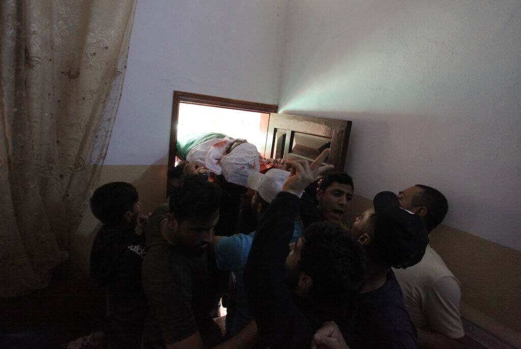 Relatives of Ahmed Al-Shenbari, who was killed amid a flare-up of Israeli-Palestinian violence, during his funeral in Beit Hanoun in the northern Gaza Strip, on May 11, 2021. (Photo: APA Images)