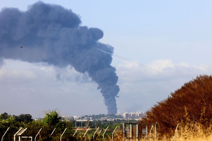 A picture taken from Yad Mordecahi in southern Israel shows a thick column of smoke billowing in the Gaza Strip following Isr