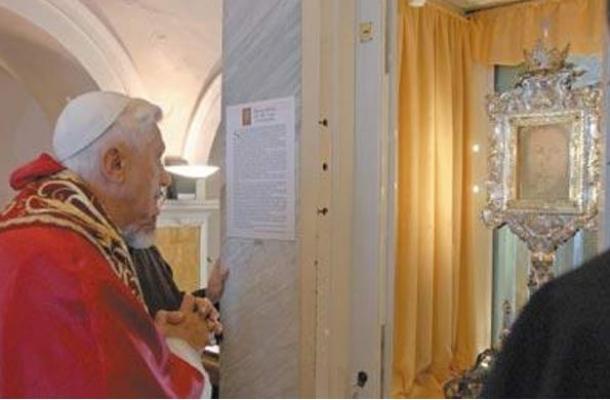 Pope Benedict XVI looks at the Veronica`s Veil during a visit to the Saint Veil monastery in Manoppello, central Italy 