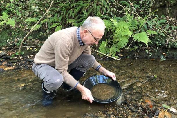 Geologist and researcher Gregor Borg of Halle-University, Germany panning for gold in the Carnon River in Cornwall, England, where the recently discovered gold bracelet’s gold alloy originated from in the late-Neolithic-Early-Bronze-Age era. (Nicolas Meyer / Campus Halensis)