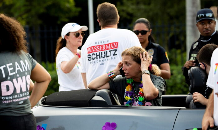 Rep. Debbie Wasserman Schultz makes a call after a truck drove into a crowd of people during The Stonewall Pride Parade and Street Festival in Wilton Manors, Fla., on June 19, 2021. (Chris Day/South Florida Sun Sentinel via Reuters)
