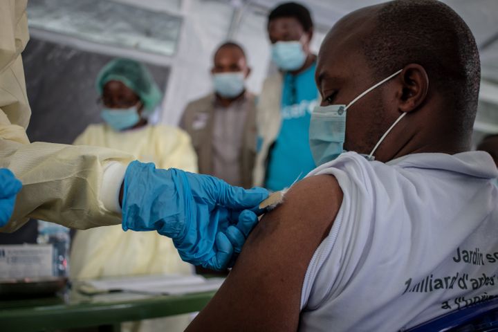 GOMA, DEMOCRATIC REPUBLIC OF CONGO - MAY 05: A health worker vaccinates a citizen with AstraZeneca during the vaccination cam