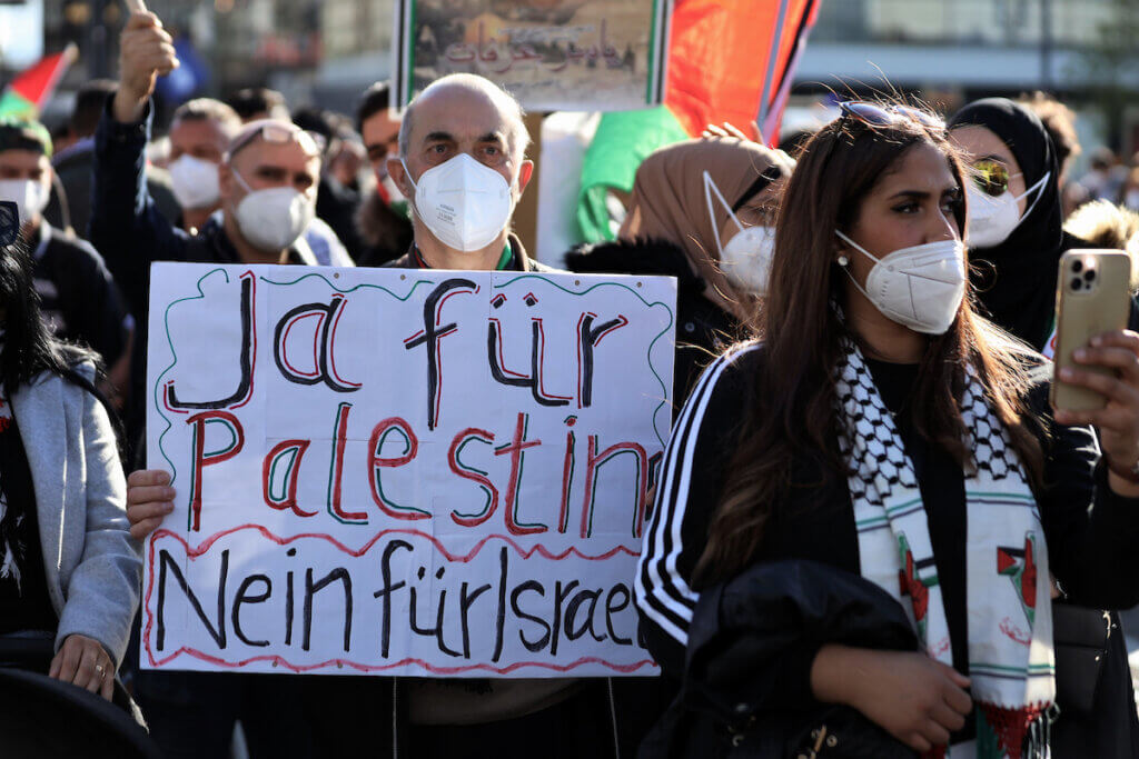 eople attend a protest rally in solidarity with Palestinians in front of Alexanderplatz in Berlin, Germany, on May 19, 2021. (Photo: Manar Shahin/APA Images)