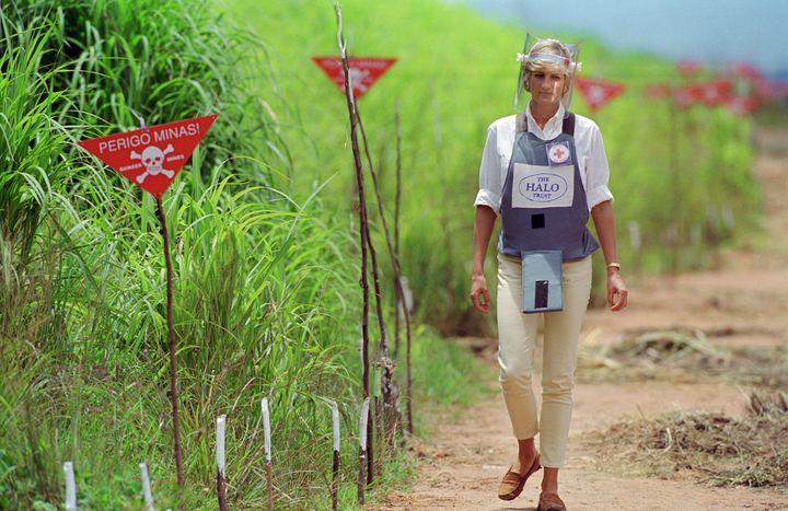 The Princess of Wales wearing protective body armor and a visor as she visits a landmine minefield being cleared by the chari