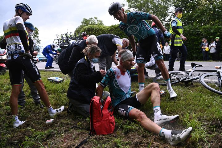 Cyril Lemoine of France is helped by medical staff members after one of Saturday's horrific crashes.
