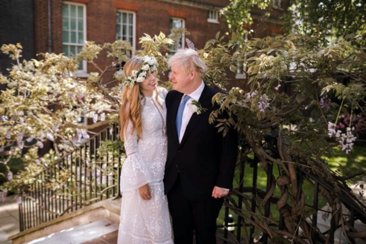 U.K. Prime Minister Boris Johnson (right) married partner Carrie Symonds over the weekend.