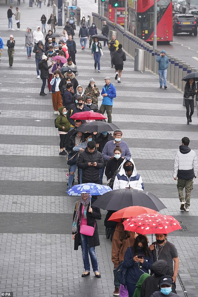 Thousands queued in the rain for jabs at Tottenham Hotspur's stadium in London yesterday (pictured) as officials launched a 'summer sprint' to vaccinate all over-18s by July 19
