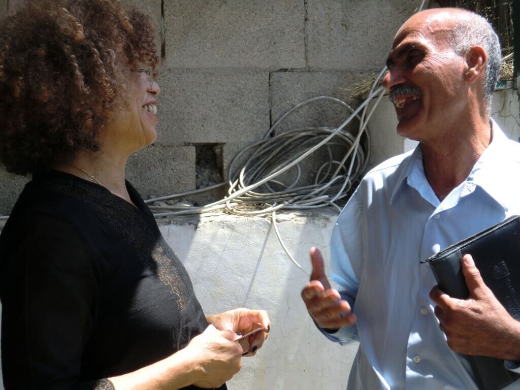 Angela Davis meets Yacoub Odeh for the first time. Freed Palestinian political prisoner Yacoub Odeh co-authored the solidarity letter Angela Davis spoke about on our first morning in Palestine at Sama Nablus. Jerusalem, June 18, 2011. (Credit: Indigenous and Women of Color Feminist Delegation to Palestine.)