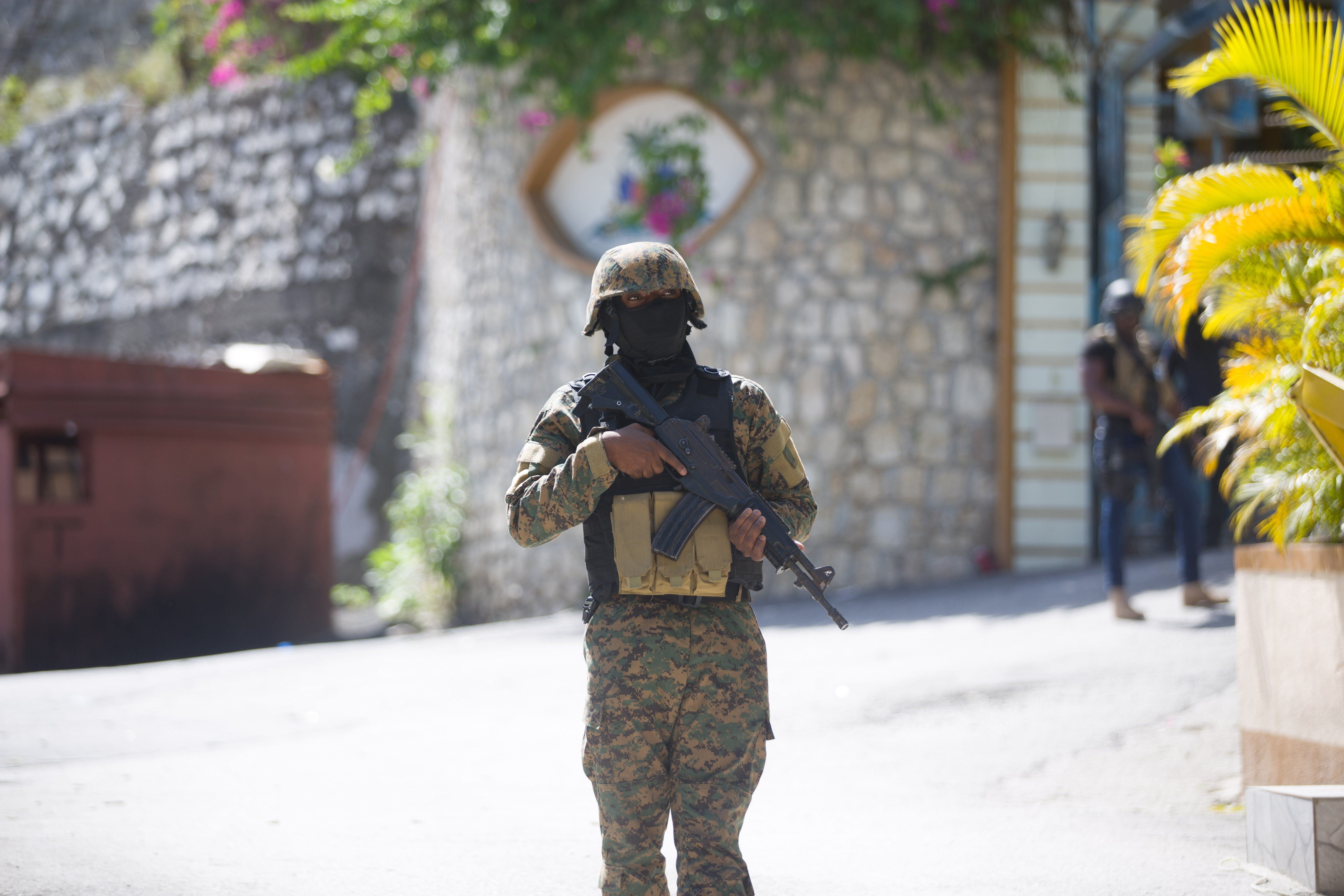 A soldier stands guard in front of Haitian President Jovenel Moise's home in Port-au-Prince, Haiti, on July 7, 2021. (Photo b
