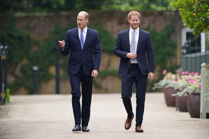 Princes William and Harry unveil a statue of their mother, Princess Diana, at the Sunken Garden in Kensington Palace on July 