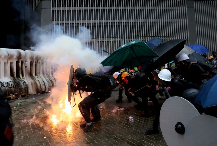 A photo taken by Danish Siddiqui shows demonstrators take cover during a protest in Hong Kong, China August 31, 2019. REUTERS