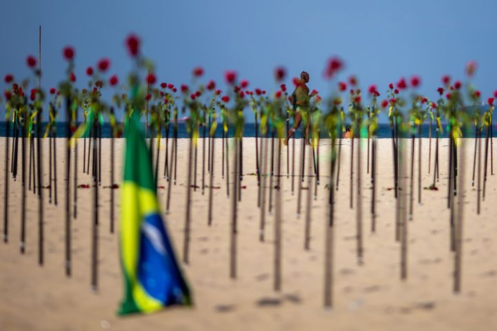 A makeshift memorial was "planted" on beaches in Rio de Janeiro in June to mark Brazil's recording of its 500,000th death rel