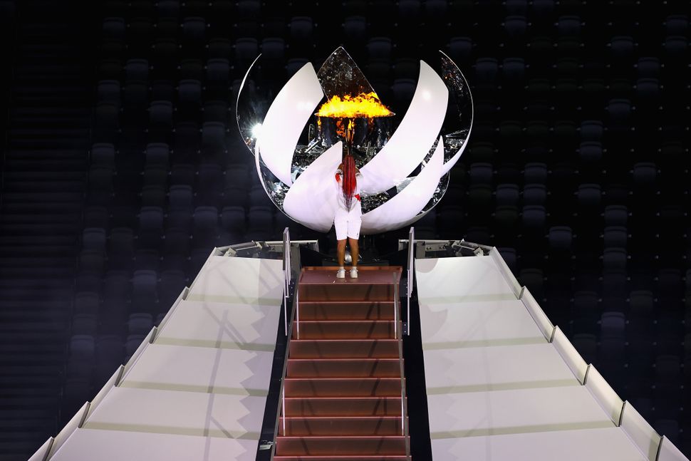 Naomi Osaka of Team Japan lights the Olympic cauldron.&nbsp;