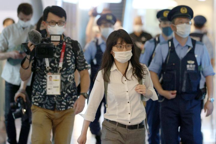 A representative with Japan Lawyers Association for Refugees is seen at Tokyo's Haneda International Airport on Sunday after 