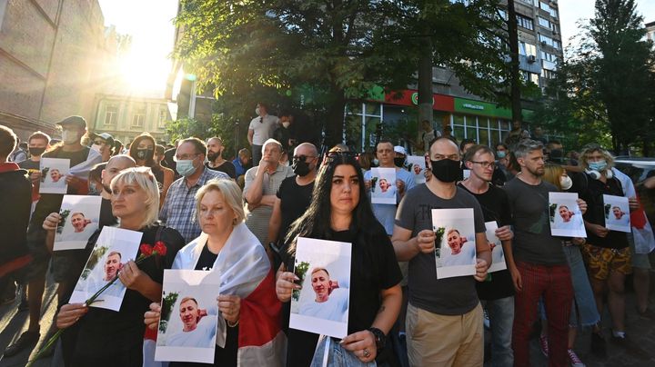Activists attend a rally outside the Belarus embassy in Kiev on August 3, 2021, in memory of Vitaly Shishov. (Photo by SERGEI
