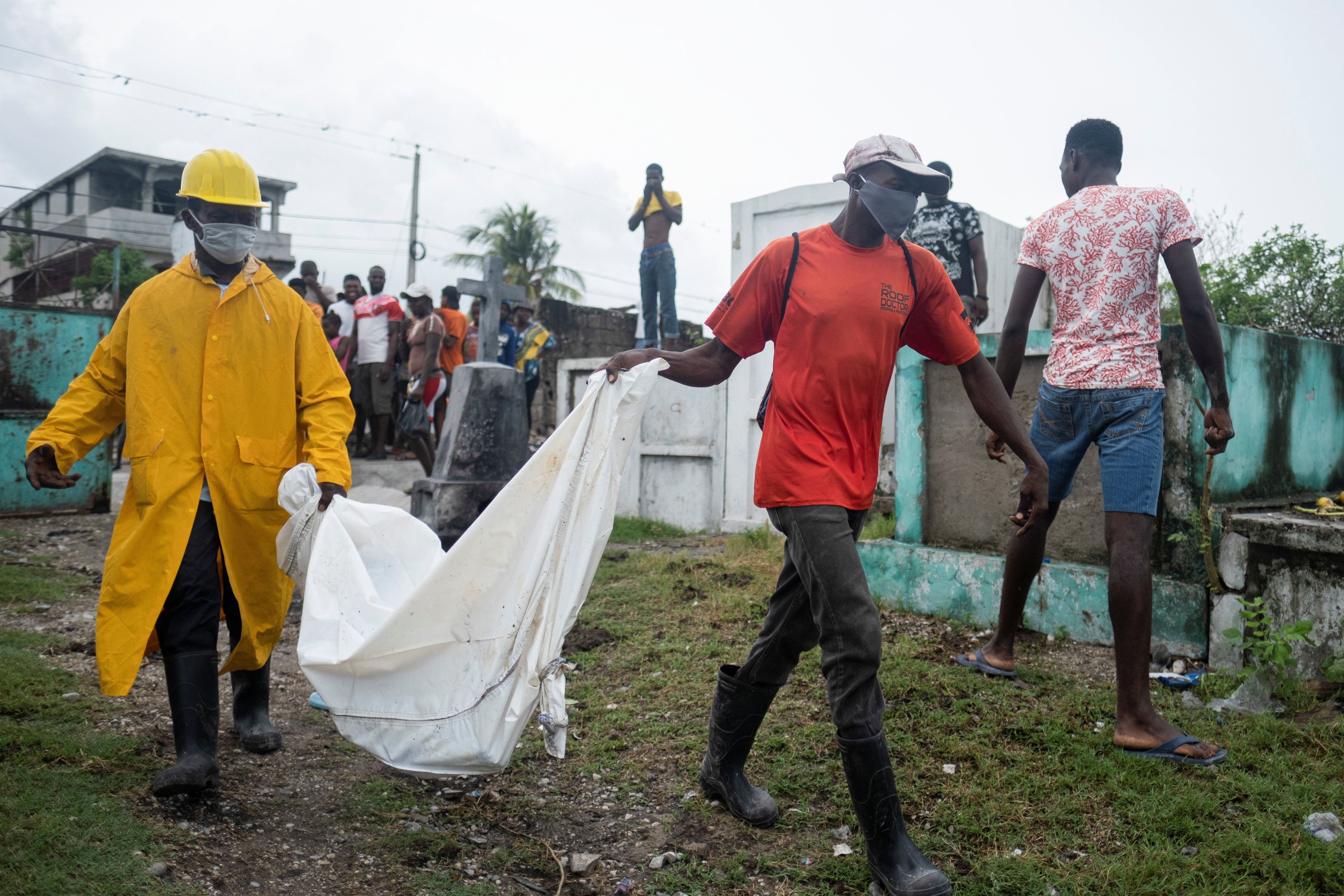 Men in Les Cayes, Haiti carry the body of a victim&nbsp;from Saturday's 7.2 magnitude quake.