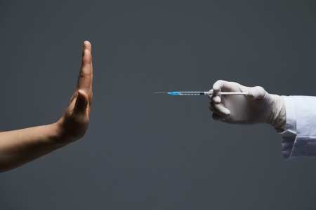 In Italy the Vaxx is no longer legally approved for use Vaccine-caution-GettyImages-1