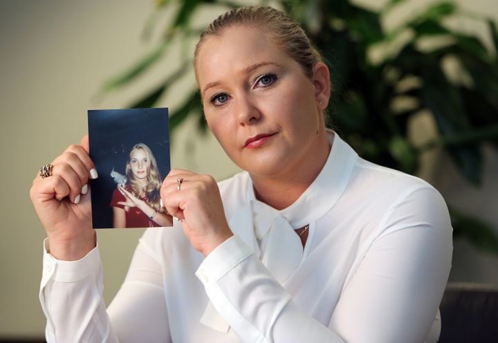 Virginia Roberts holds a photo of herself at age 16, when she says Jeffrey Epstein began abusing her sexually.&nbsp;