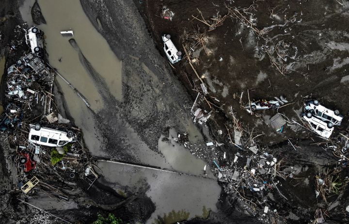 An aerial photo shows overturned cars among destruction in a mud-covered street in Bozkurt town of Kastamonu province, Turkey