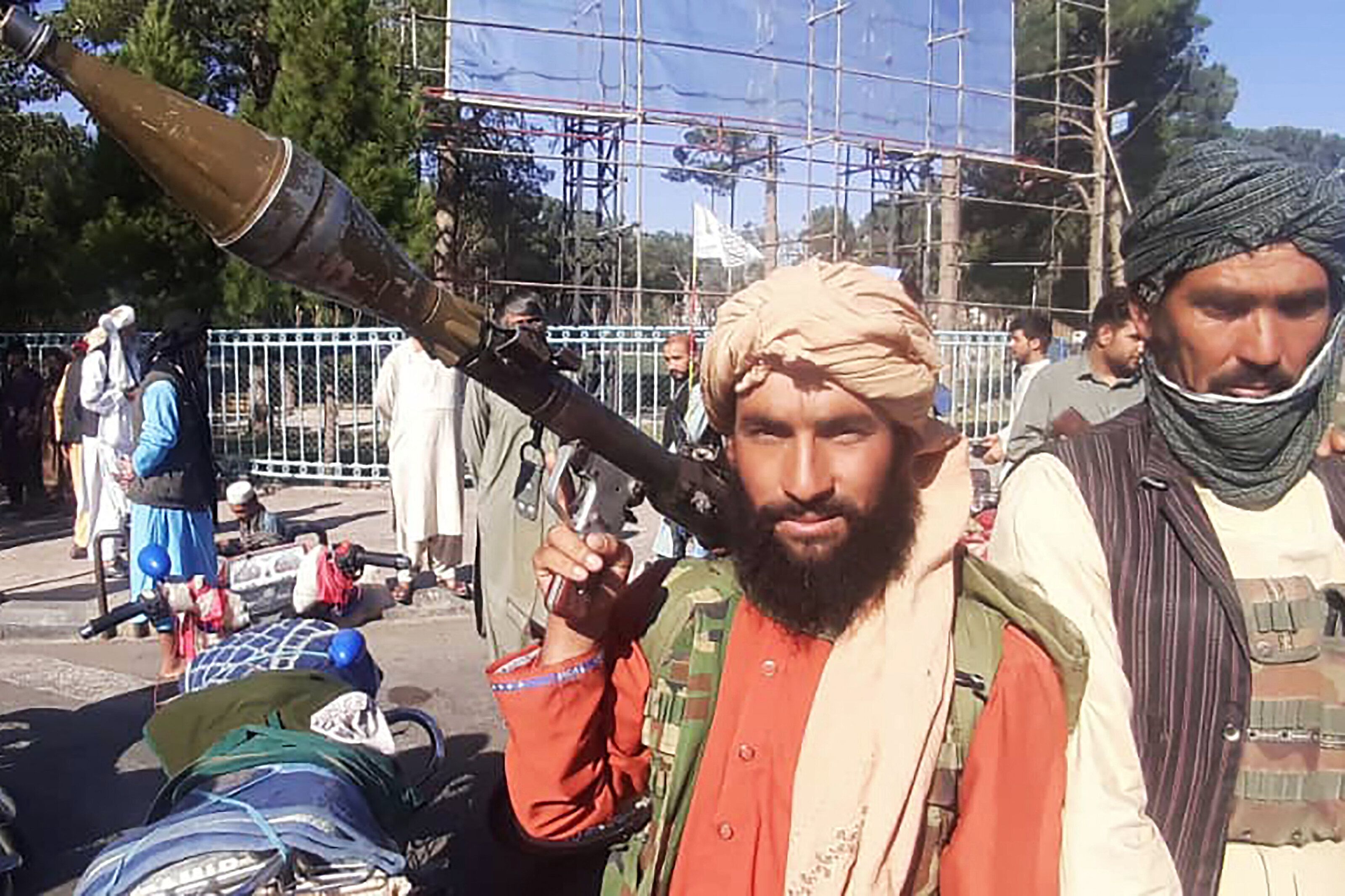 A Taliban fighter holds a rocket-propelled grenadea long the roadside in Herat, Afghanistan's third biggest city, on Aug. 12.