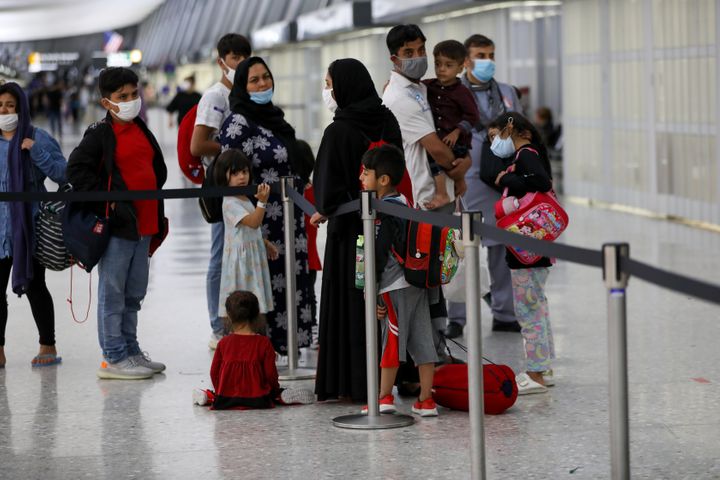 Afghan refugees evacuated from Kabul, arrive in Washington Dulles International Airport in Washington, DC, on Aug. 27.
