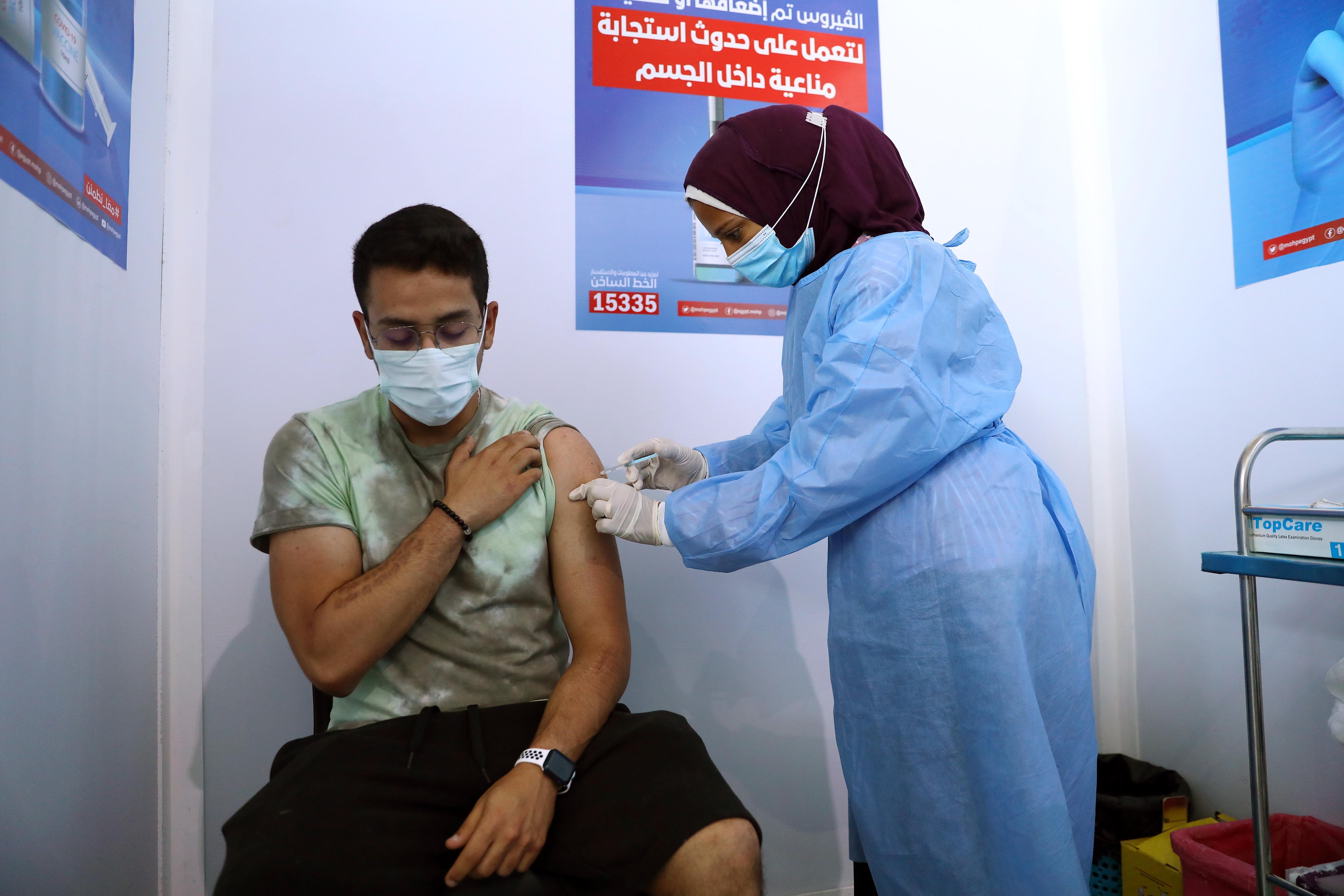 A man receives the COVID-19 vaccine at a mass vaccination venue in Cairo, Egypt.&nbsp;