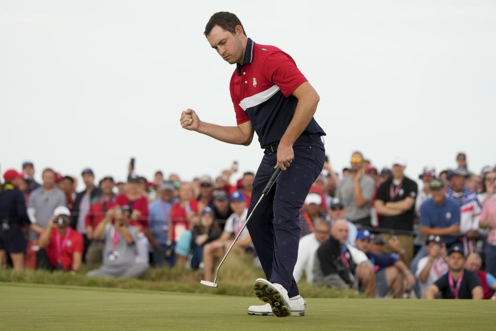 Team USA's Patrick Cantlay makes a putt on the 15th hole during a Ryder Cup singles match at the Whistling Straits Golf Course Sunday, Sept. 26, 2021, in Sheboygan, Wis. (AP Photo/Charlie Neibergall)