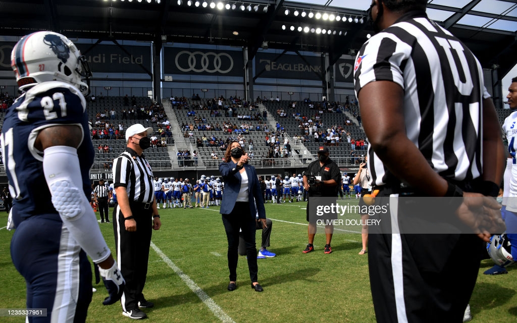 Vice President Kamala Harris tosses the coin for the football game between Howard University and Hampton University at Audi Field in Washington, DC,...