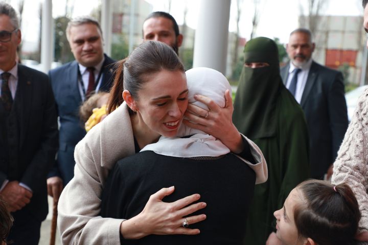 Jacinda Ardern consoling a grieving woman after the 2019 attacks.