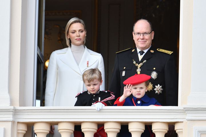 Princess Charlene and Prince Albert II of Monaco, with children Jacques and Gabriella, pose on the palace balcony during the 