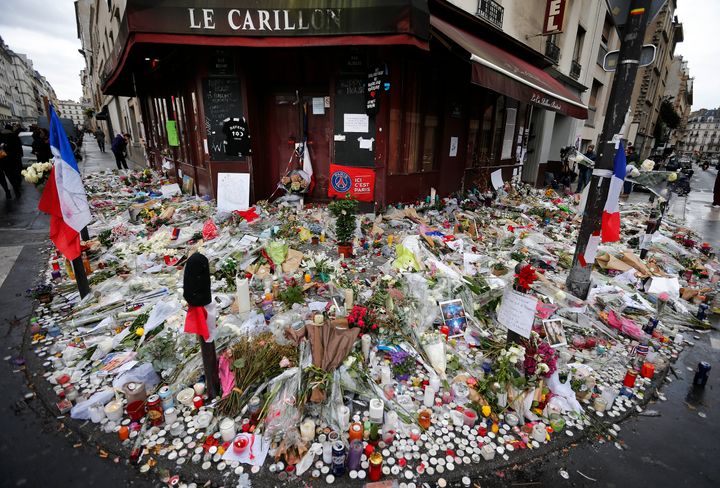 This 2015 file photo shows some of the flowers and candle tributes that were placed at the Restaurant Le Carillon in Paris, a